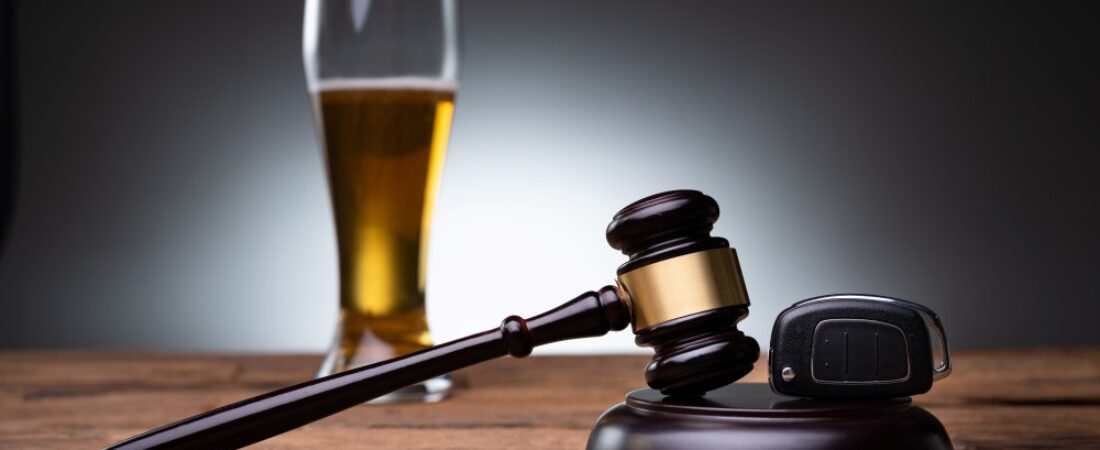DUI Lawyer concept. Car Key, Gavel and Beer on table.