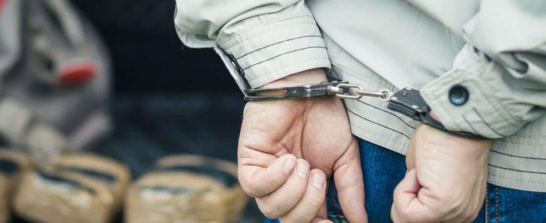 A man in handcuffs detained the transportation of drugs.